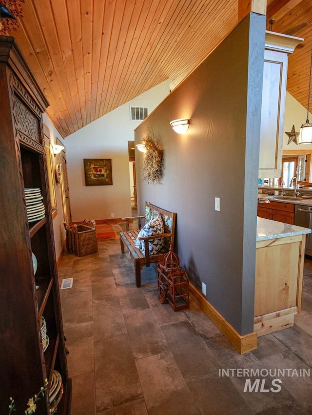 986 Valley Rim Rd, Mccall, ID 83638 - living area featuring lofted ceiling, wood ceiling, and baseboards