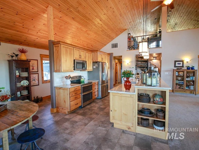 986 Valley Rim Rd, Mccall, ID 83638 - kitchen with appliances with stainless steel finishes, a ceiling fan, light brown cabinets, wooden ceiling, and high vaulted ceiling
