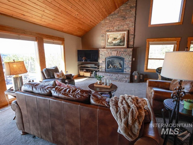 986 Valley Rim Rd, Mccall, ID 83638 - carpeted living area with wooden ceiling, a stone fireplace, and high vaulted ceiling