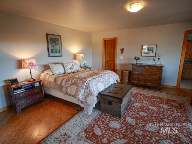 986 Valley Rim Rd, Mccall, ID 83638 - bedroom with baseboards and wood finished floors