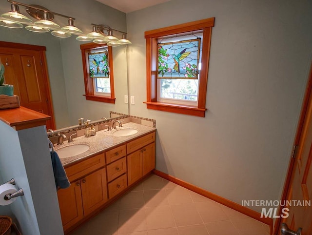 986 Valley Rim Rd, Mccall, ID 83638 - full bathroom with double vanity, baseboards, and tile patterned flooring