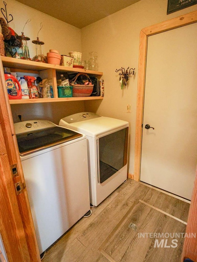 986 Valley Rim Rd, Mccall, ID 83638 - laundry room with washing machine and dryer and light wood-style floors