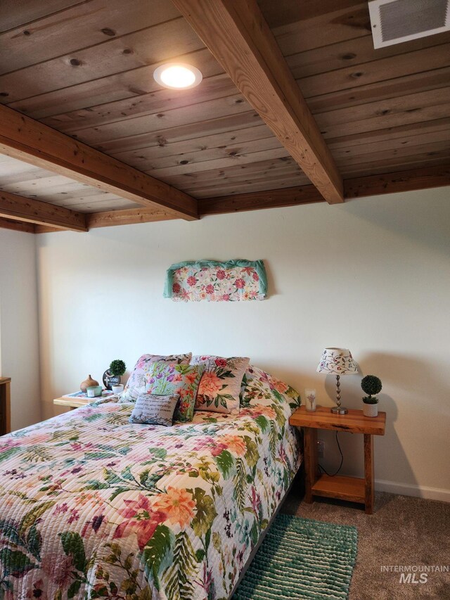232 Camas Rd, Grangeville, ID 83530 - bedroom featuring beam ceiling, carpet floors, wooden ceiling, and baseboards