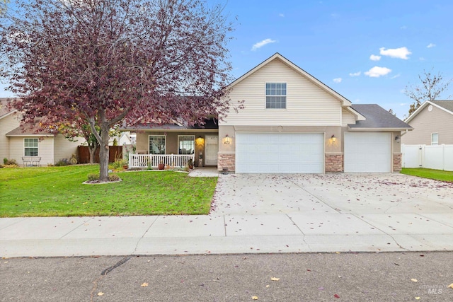 view of front of property featuring a front yard and a garage