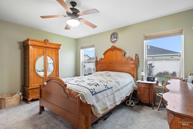 bedroom with light carpet and ceiling fan
