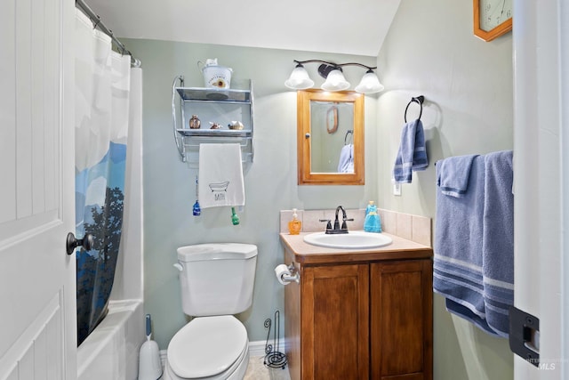 bathroom with toilet and vanity