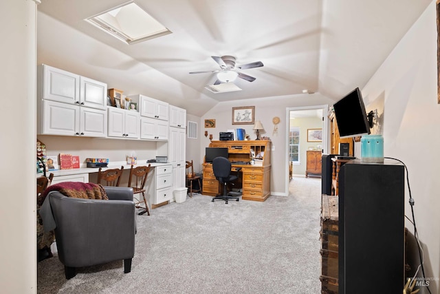 home office with light colored carpet, lofted ceiling, and a ceiling fan