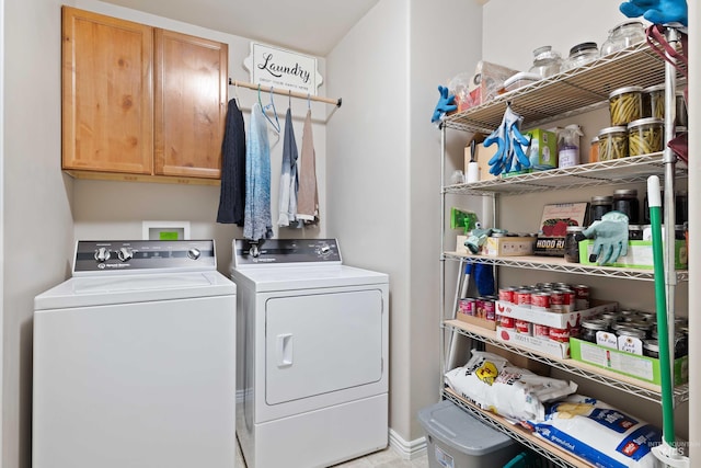 laundry area with washing machine and dryer and cabinet space