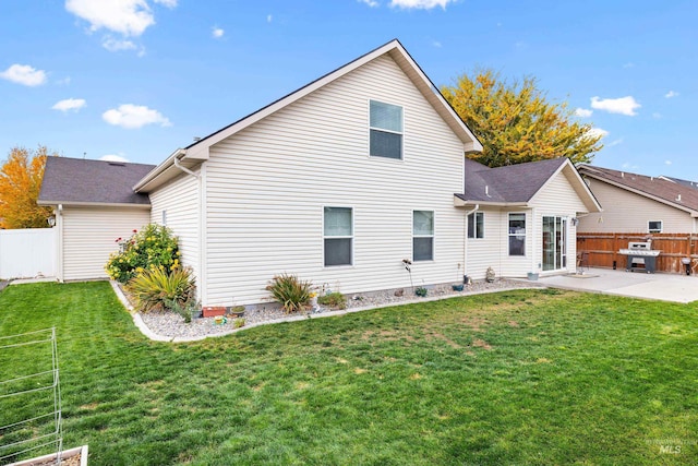 back of house with a patio and a shingled roof