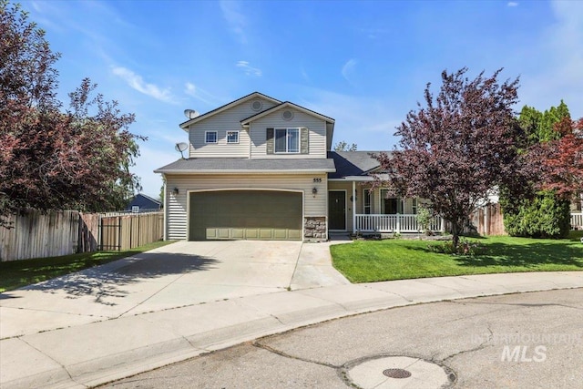 555 W Mulberry Loop, Nampa, ID 83686 - traditional-style home with a garage, concrete driveway, covered porch, and stone siding