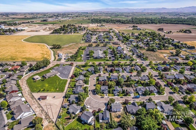 555 W Mulberry Loop, Nampa, ID 83686 - aerial overview of property's location with a mountainous background and nearby suburban area