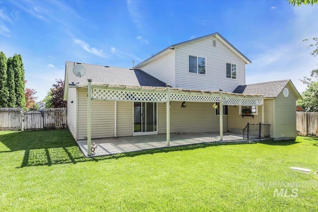 555 W Mulberry Loop, Nampa, ID 83686 - rear view of house with a patio and a shingled roof