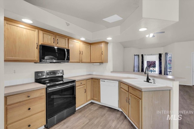 555 W Mulberry Loop, Nampa, ID 83686 - kitchen with electric range, dishwasher, light brown cabinets, a peninsula, and recessed lighting