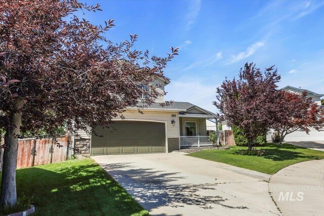 555 W Mulberry Loop, Nampa, ID 83686 - obstructed view of property with concrete driveway and an attached garage