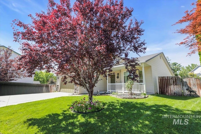 555 W Mulberry Loop, Nampa, ID 83686 - obstructed view of property featuring a porch, driveway, and an attached garage