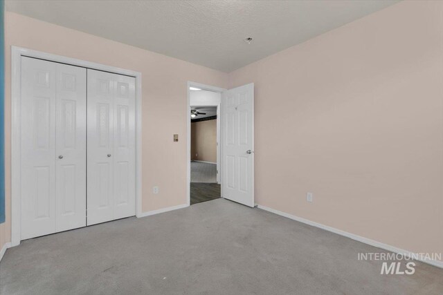 555 W Mulberry Loop, Nampa, ID 83686 - unfurnished bedroom featuring carpet floors and a closet