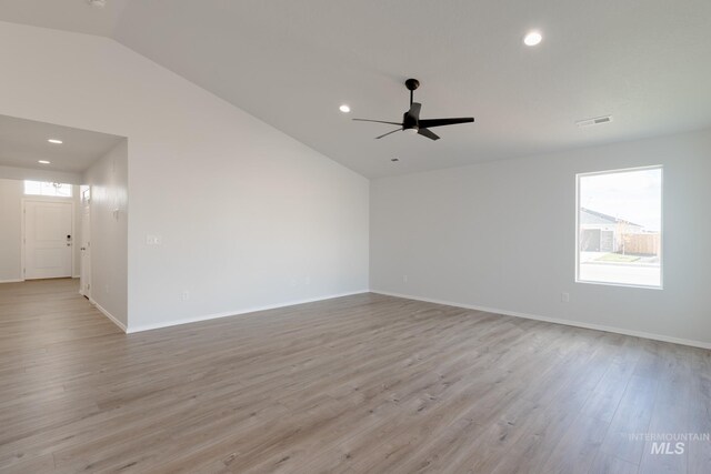 empty room featuring visible vents, baseboards, recessed lighting, light wood-style flooring, and a ceiling fan