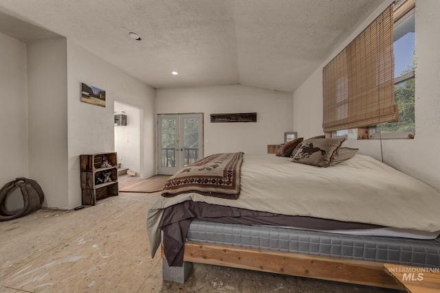 1507 Scheloske Rd, Weiser, ID 83672 - bedroom featuring access to exterior, a textured ceiling, and lofted ceiling