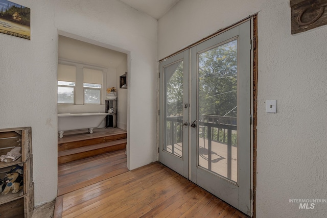 1507 Scheloske Rd, Weiser, ID 83672 - doorway with hardwood / wood-style floors, french doors, and a textured wall