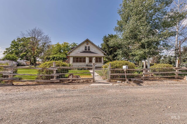 1507 Scheloske Rd, Weiser, ID 83672 - bungalow-style house with a fenced front yard and a gate