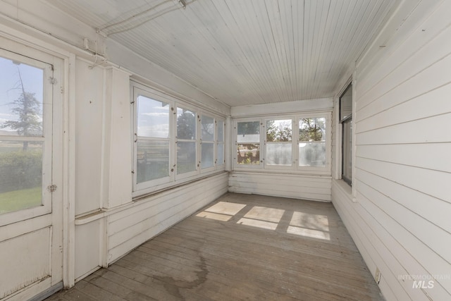 1507 Scheloske Rd, Weiser, ID 83672 - unfurnished sunroom with healthy amount of natural light, wood walls, and wood-type flooring