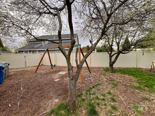 view of yard with a fenced backyard