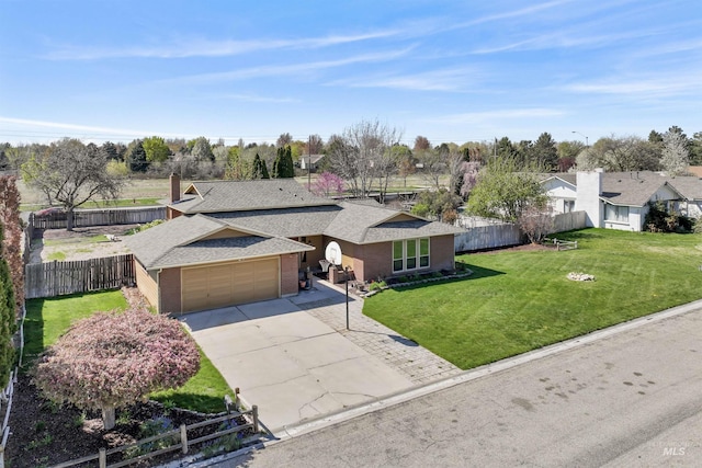 11185 W Humming Bird Dr, Boise, ID 83709 - single story home with a shingled roof, concrete driveway, a garage, brick siding, and a residential view