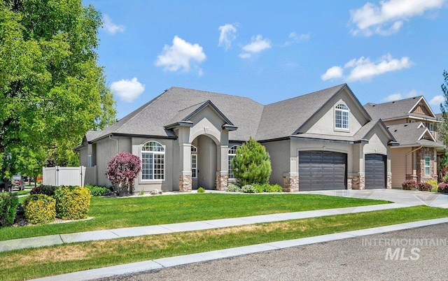 2652 E Fratello St, Meridian, ID 83642 - french provincial home with stucco siding, driveway, stone siding, and a garage