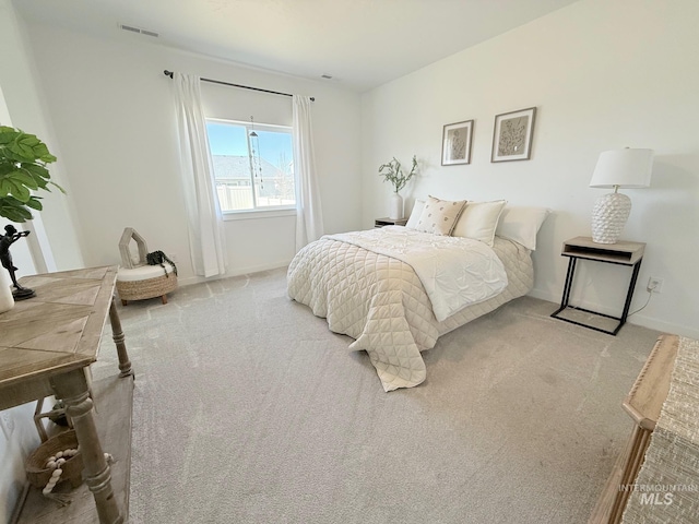 bedroom featuring carpet, visible vents, and baseboards