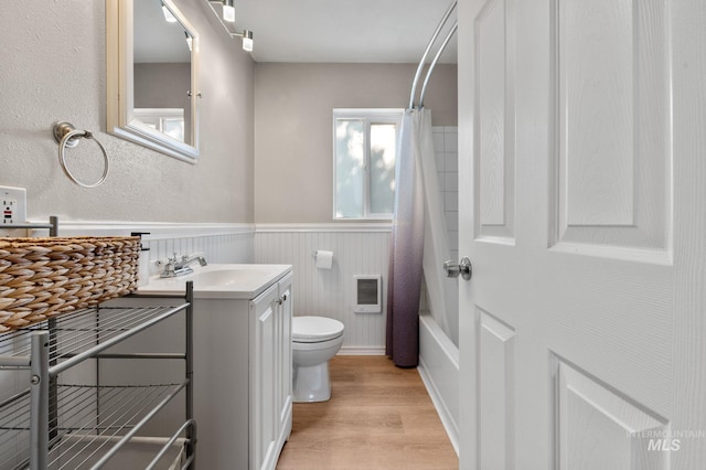13771/2 Poplar, Clarkston, WA 99403 - full bath featuring vanity, toilet, wood finished floors, wainscoting, and heating unit