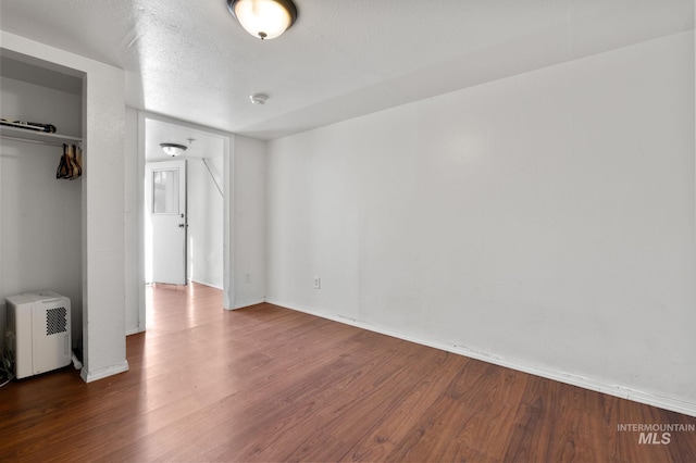 13771/2 Poplar, Clarkston, WA 99403 - unfurnished bedroom with wood finished floors, baseboards, and a closet
