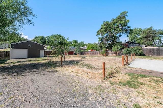 13771/2 Poplar, Clarkston, WA 99403 - view of yard with a detached garage, an outbuilding, and driveway