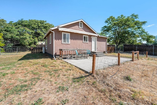 13771/2 Poplar, Clarkston, WA 99403 - back of house with stucco siding, a patio, and entry steps