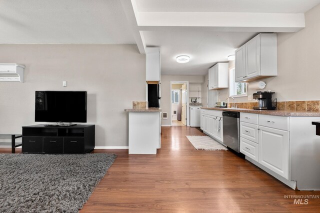 13771/2 Poplar, Clarkston, WA 99403 - kitchen with stainless steel dishwasher, white cabinetry, wood finished floors, and a wall mounted AC