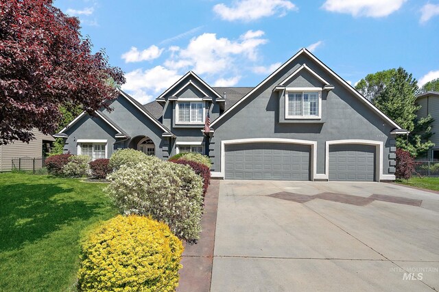 6114 N Cape Arago Pl, Boise, ID 83714 - view of front of property featuring stucco siding and concrete driveway