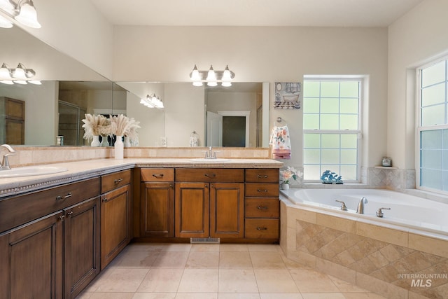 6114 N Cape Arago Pl, Boise, ID 83714 - full bathroom featuring a garden tub, tile patterned flooring, double vanity, and a stall shower