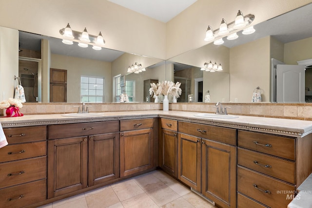 6114 N Cape Arago Pl, Boise, ID 83714 - full bathroom featuring tile patterned flooring, double vanity, and an enclosed shower