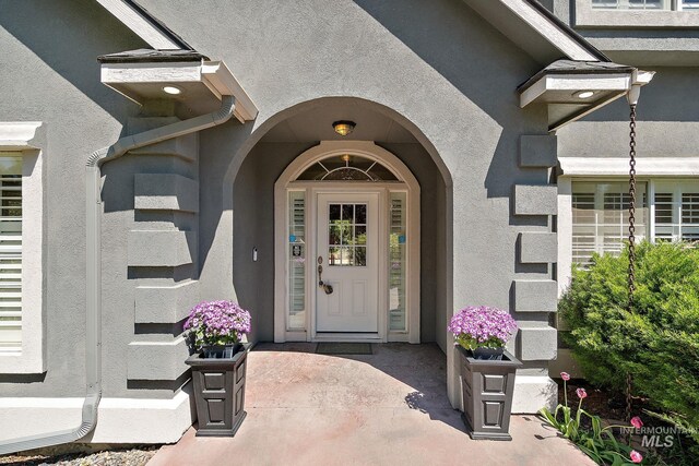 6114 N Cape Arago Pl, Boise, ID 83714 - doorway to property with stucco siding