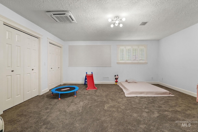 6114 N Cape Arago Pl, Boise, ID 83714 - game room with carpet flooring, baseboards, and a textured ceiling