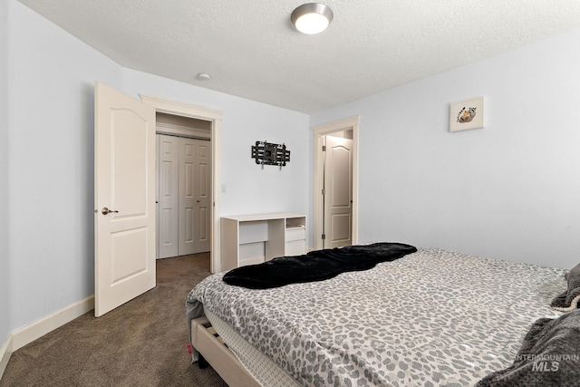 6114 N Cape Arago Pl, Boise, ID 83714 - bedroom featuring dark carpet, a textured ceiling, and baseboards