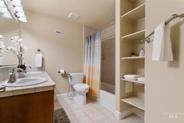 6114 N Cape Arago Pl, Boise, ID 83714 - bathroom featuring tile patterned floors, toilet, a textured ceiling, shower / tub combo with curtain, and baseboards