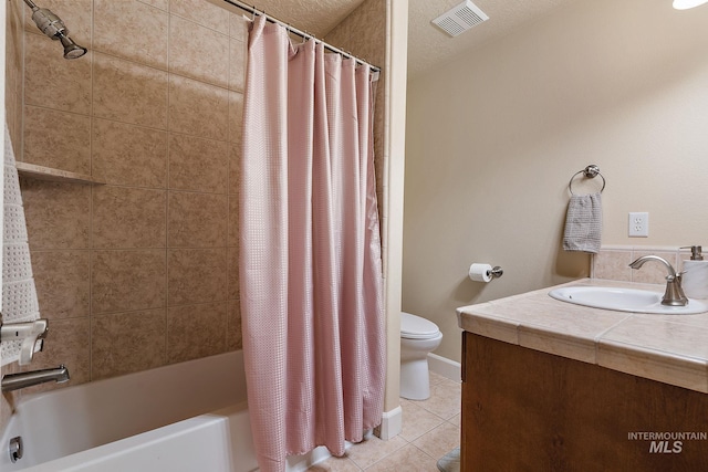 6114 N Cape Arago Pl, Boise, ID 83714 - bathroom with tile patterned flooring, toilet, shower / bath combo, and vanity