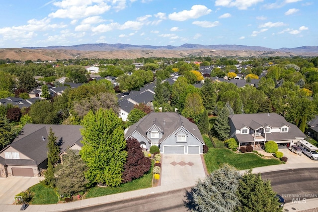 6114 N Cape Arago Pl, Boise, ID 83714 - aerial perspective of suburban area featuring a mountain backdrop