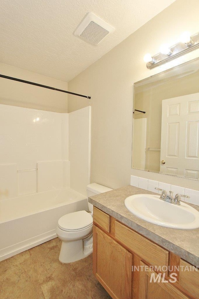 bathroom featuring vanity, visible vents, toilet, a textured ceiling, and  shower combination