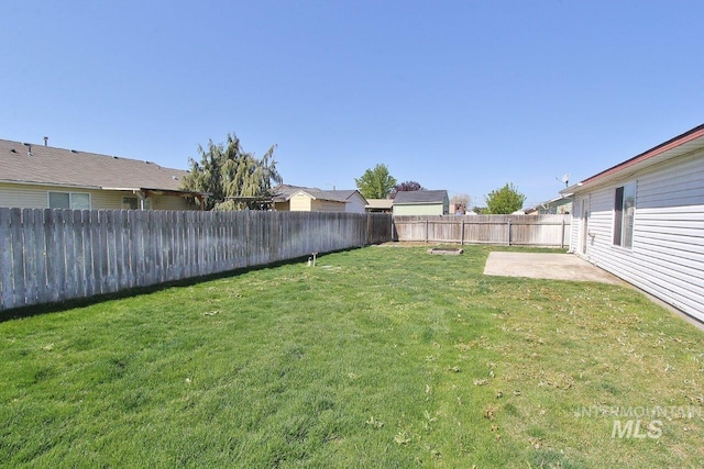 view of yard with a patio and a fenced backyard