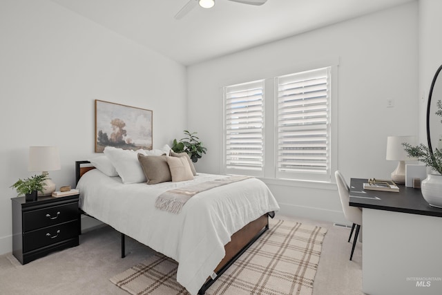 bedroom featuring light colored carpet and ceiling fan