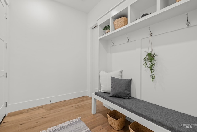 mudroom with hardwood / wood-style flooring