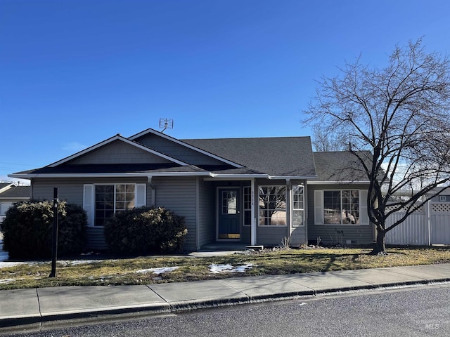 view of front of property featuring a shingled roof