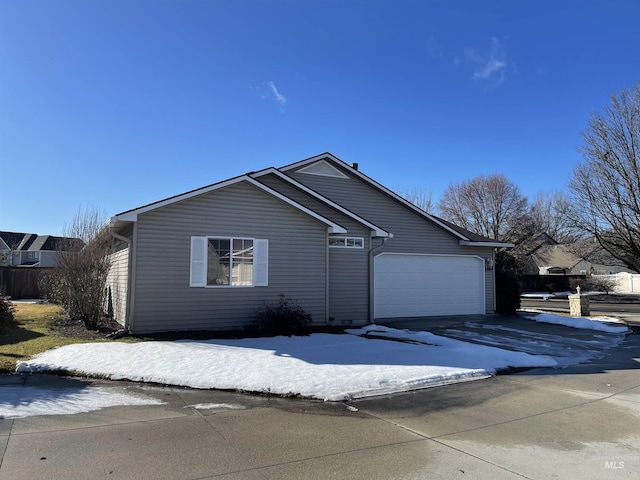 6064 N Lake Shore Ave, Garden City, ID 83714 - view of front of house with an attached garage and driveway