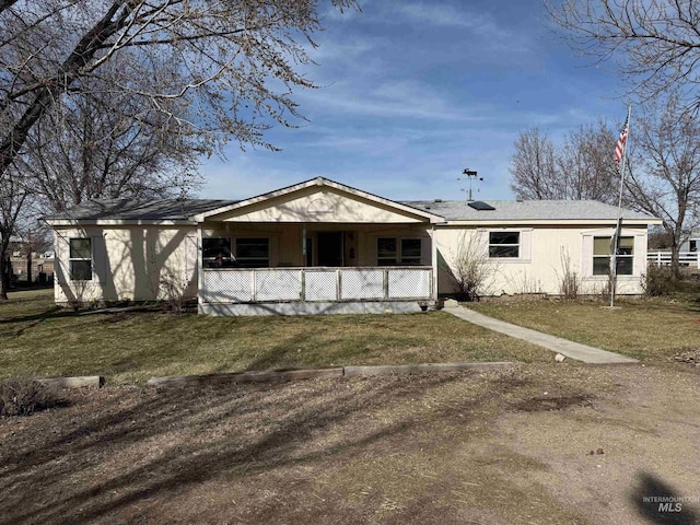 ranch-style house with a front lawn